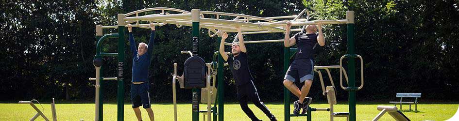 3 men exercising on Fresh Air Fitness gym equipment