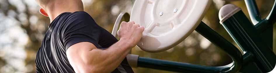 Man using Fresh Air Fitness equipment