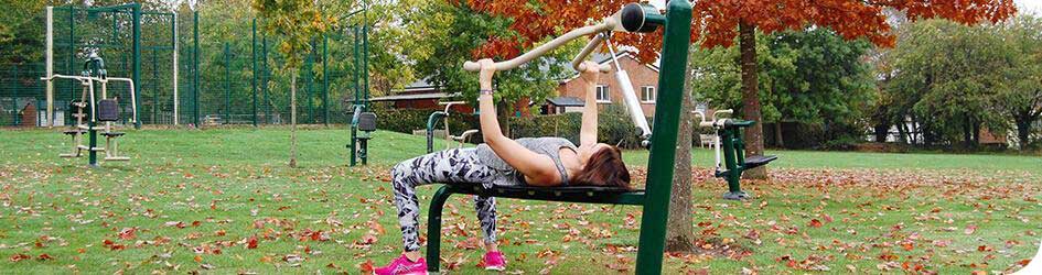Woman exercising on Fresh Air Fitness equipment