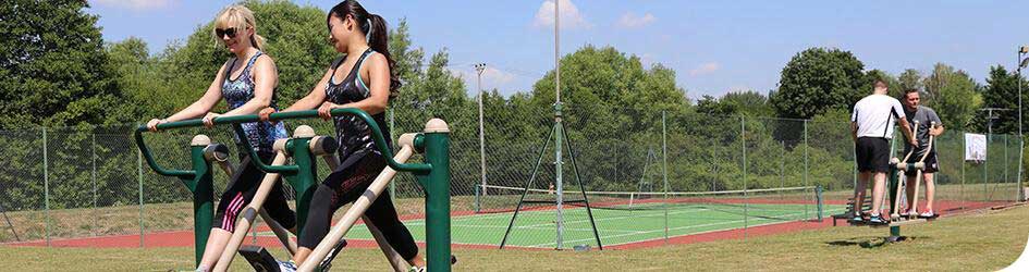 Walkers exercising on Fresh Air Fitness equipment