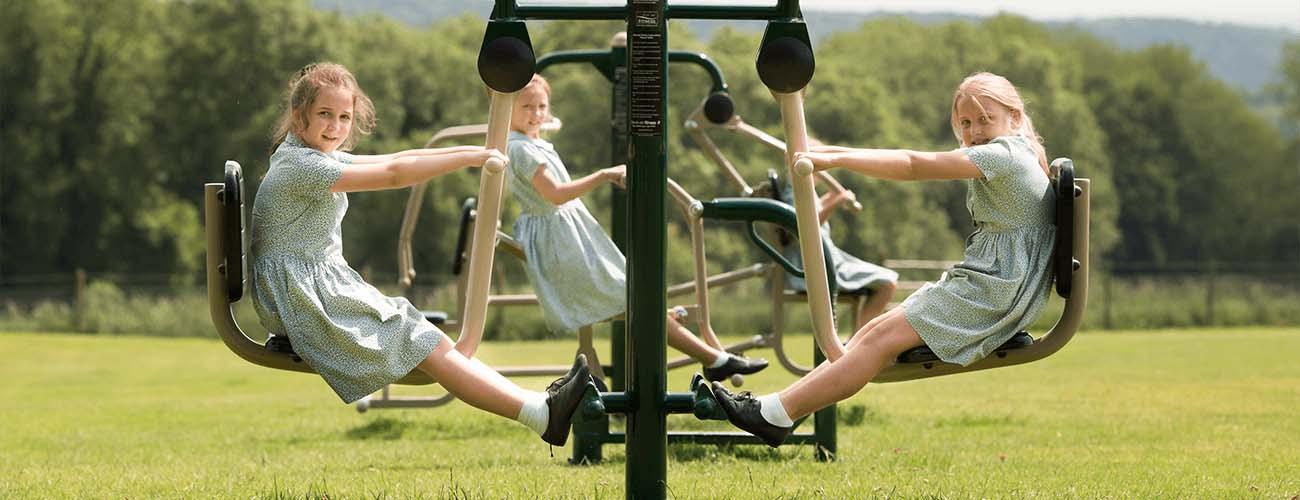primary school outdoor gym equipment in use