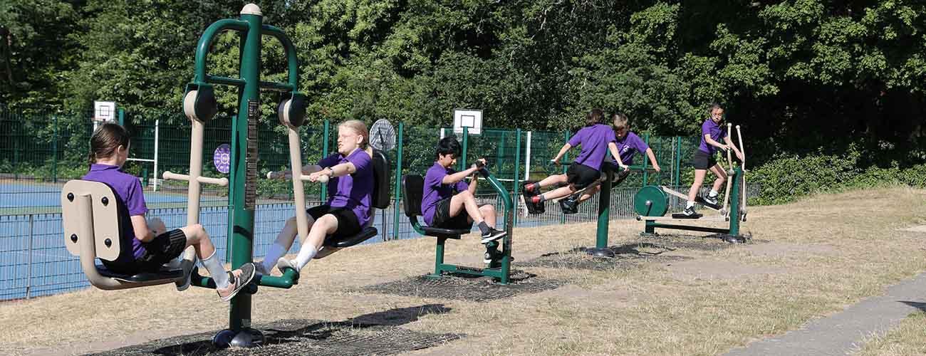 Ravenscote Junior School Fresh Air Fitness Outdoor Gym being used by children