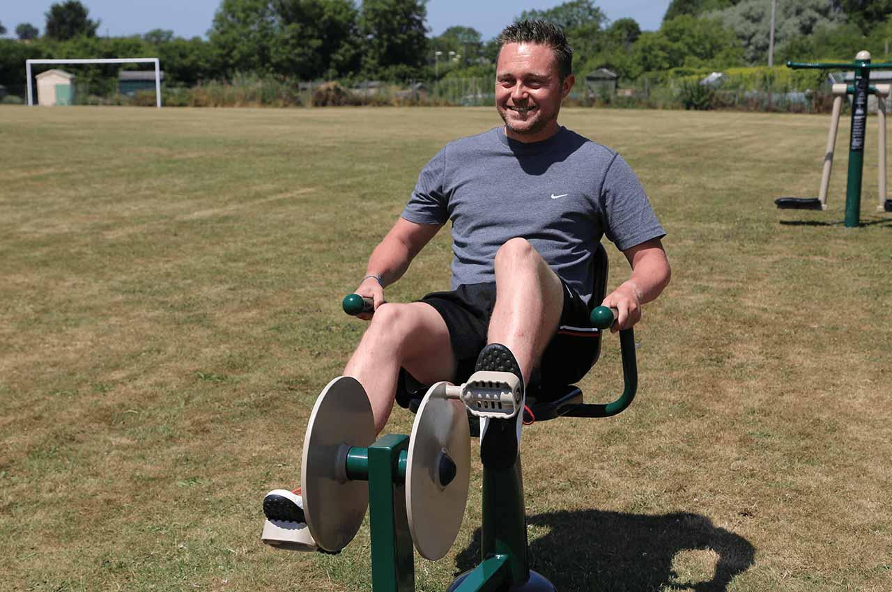man using recumbent bike