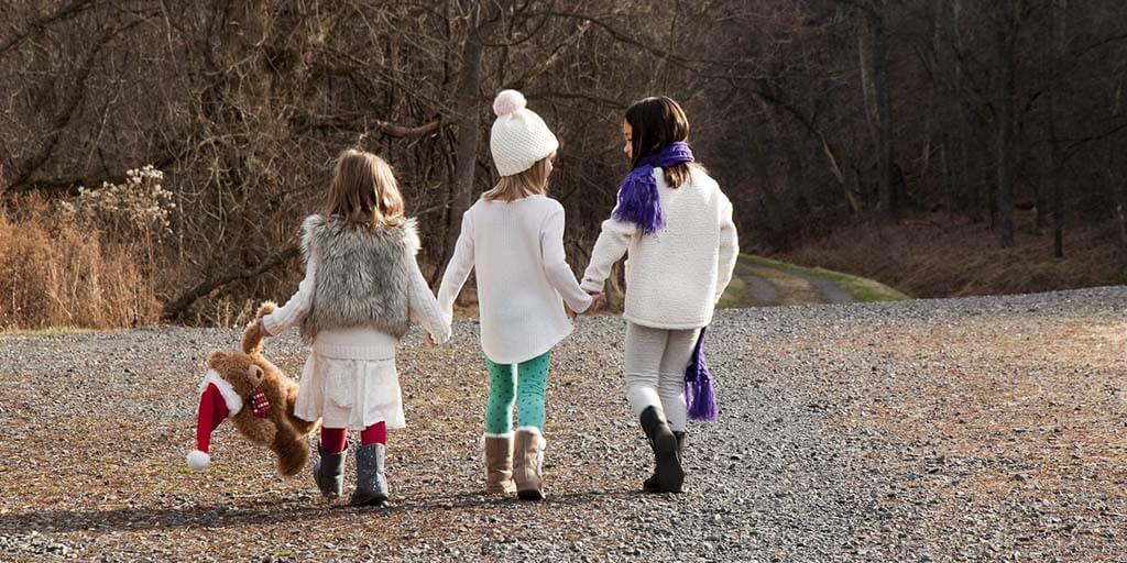 3 girls walking at Christmas