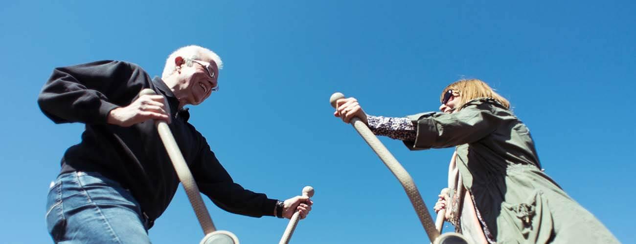 older people using fresh air fitness outdoor gym equipment