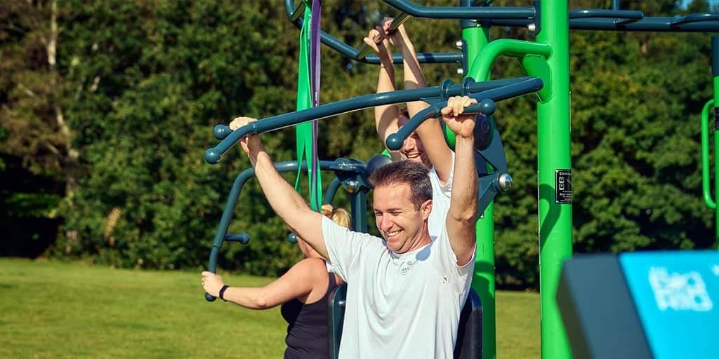 couple using Fresh Air Fitness Outdoor Gym Equipment The Big Rig