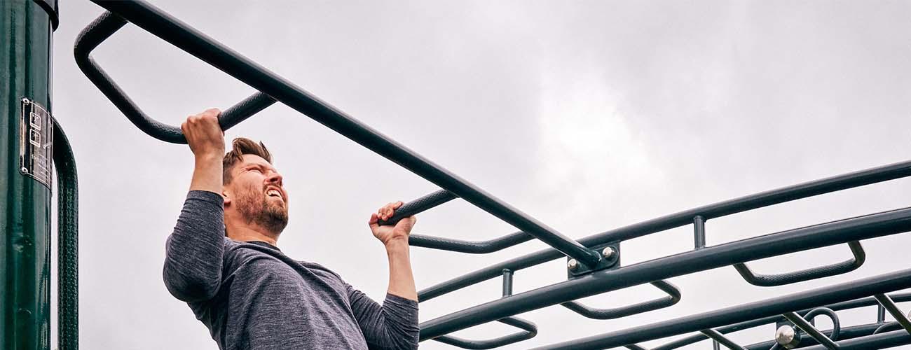 man using big rig outdoor gym equipment