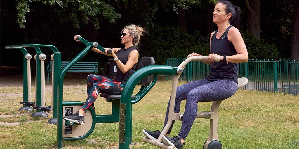 women working out on outdoor gym