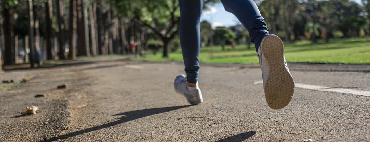 someone running outdoors in park