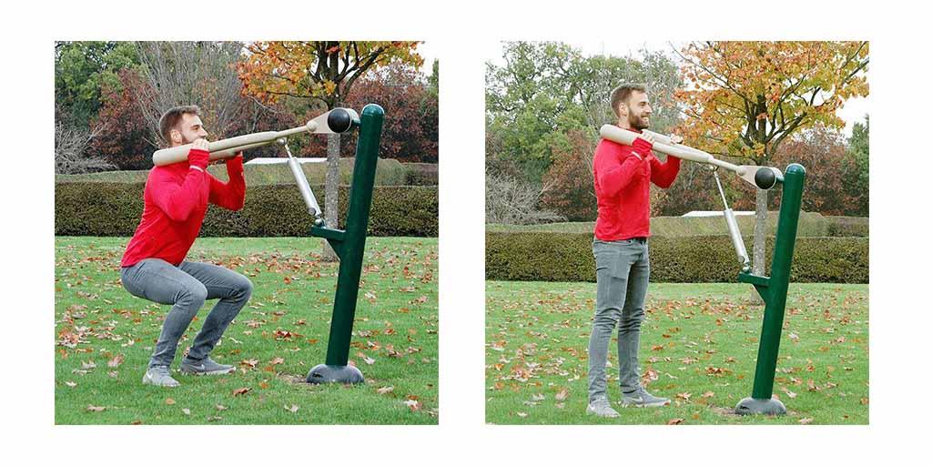 man using the resistance squat station