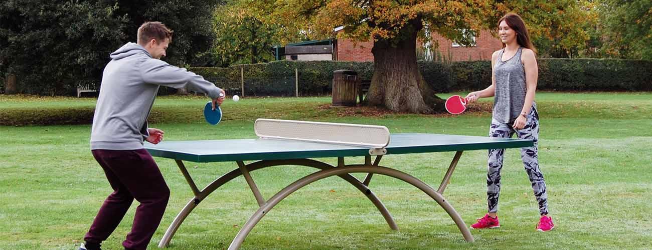 community using table tennis table in park