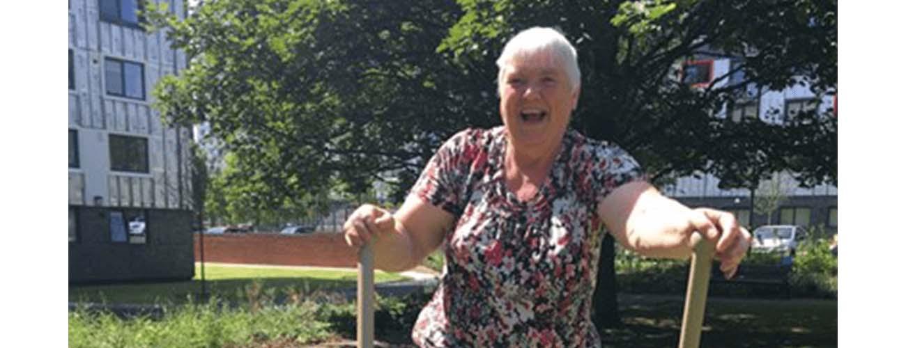 Lady using outdoor gyms for senior fitness